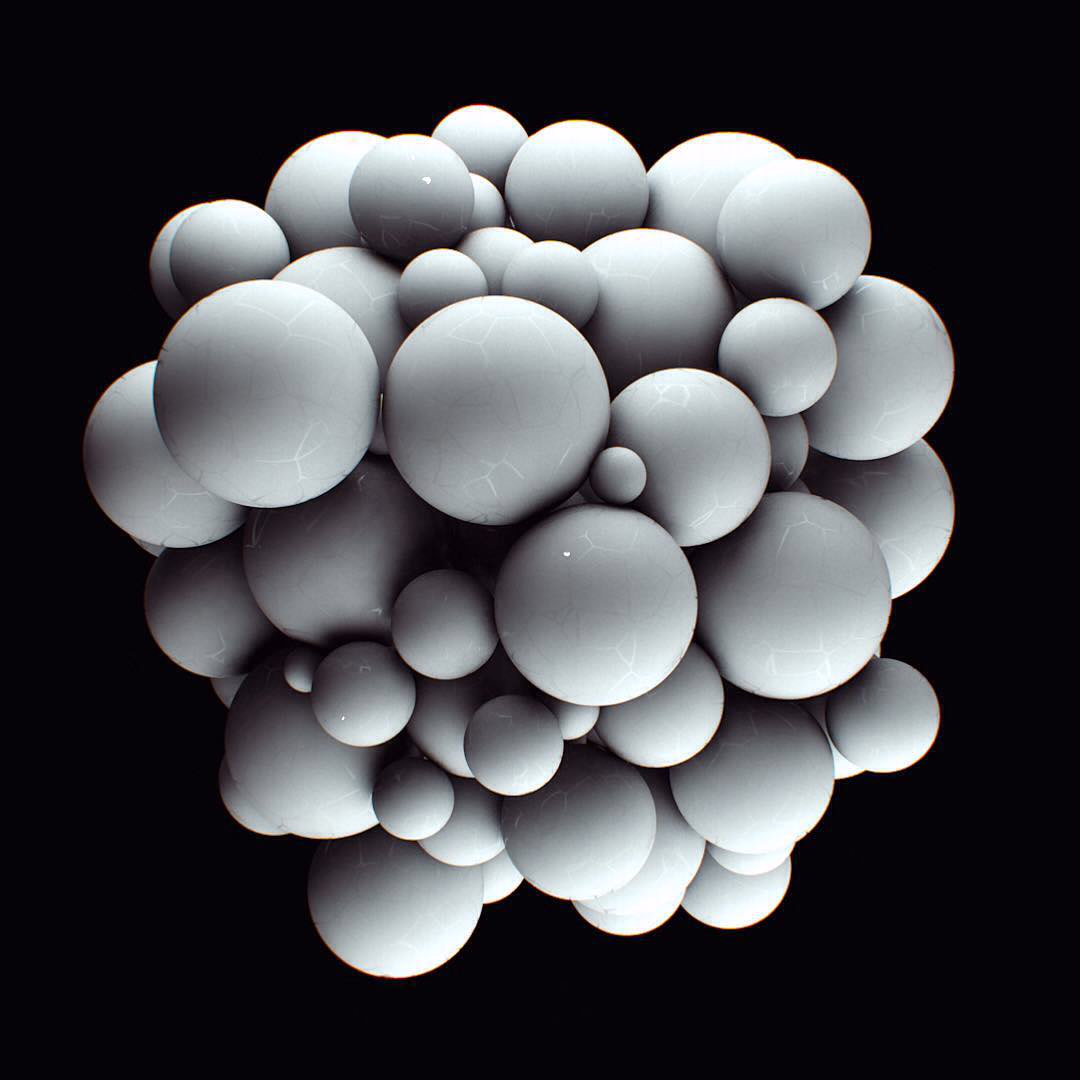 A cluster of glossy white spheres of different sizes on a black background.