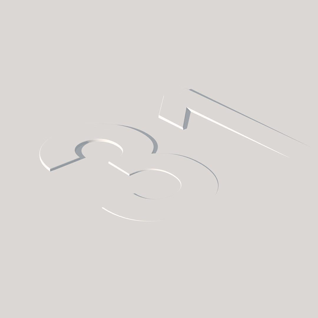 Numerals cut as shallow, slanted reliefs into a flat pale grey surface.
