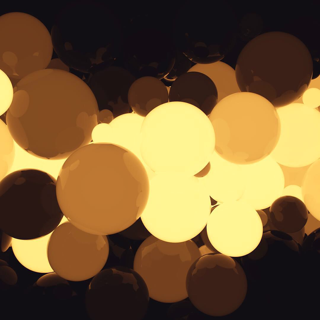 Glowing amber and yellow spheres piled together in the dark.